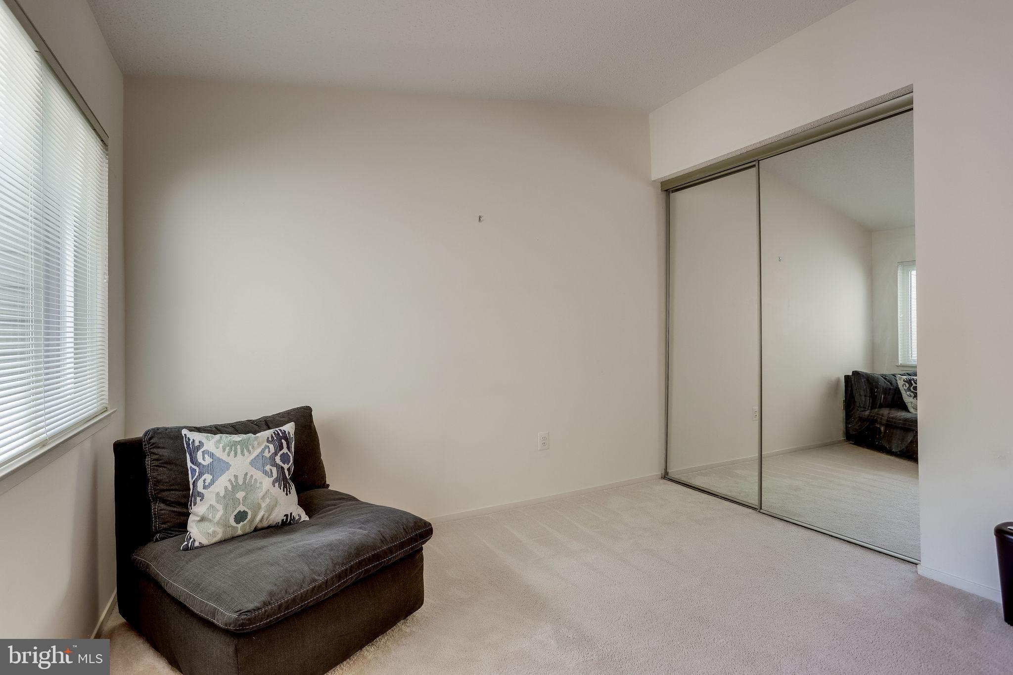 11027 Villaridge Court Reston, VA 20191 - Photo 22 of 28 a living room with furniture and a potted plant