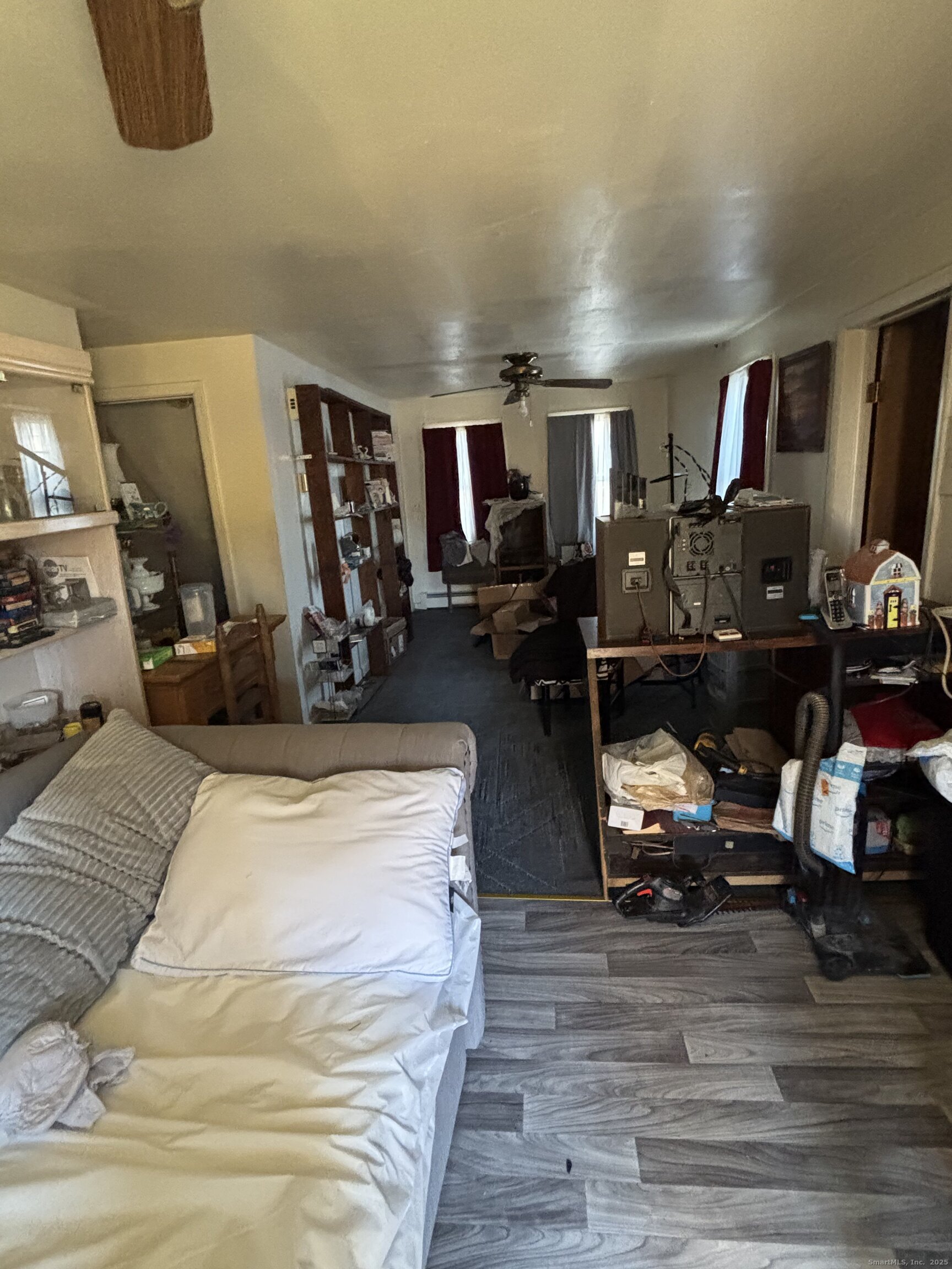 509 Pembroke Street Bridgeport, CT 06608 - Photo 11 of 25 a view of a bedroom with workspace and wooden floor