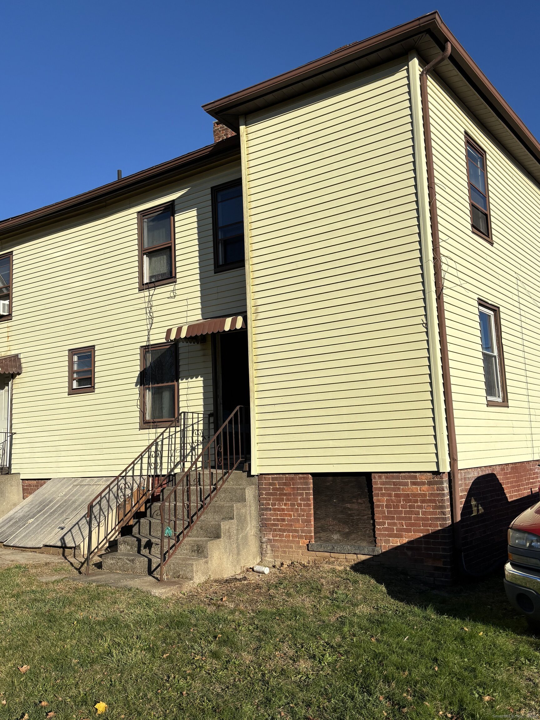 509 Pembroke Street Bridgeport, CT 06608 - Photo 12 of 25 a view of a house with a yard and stairs