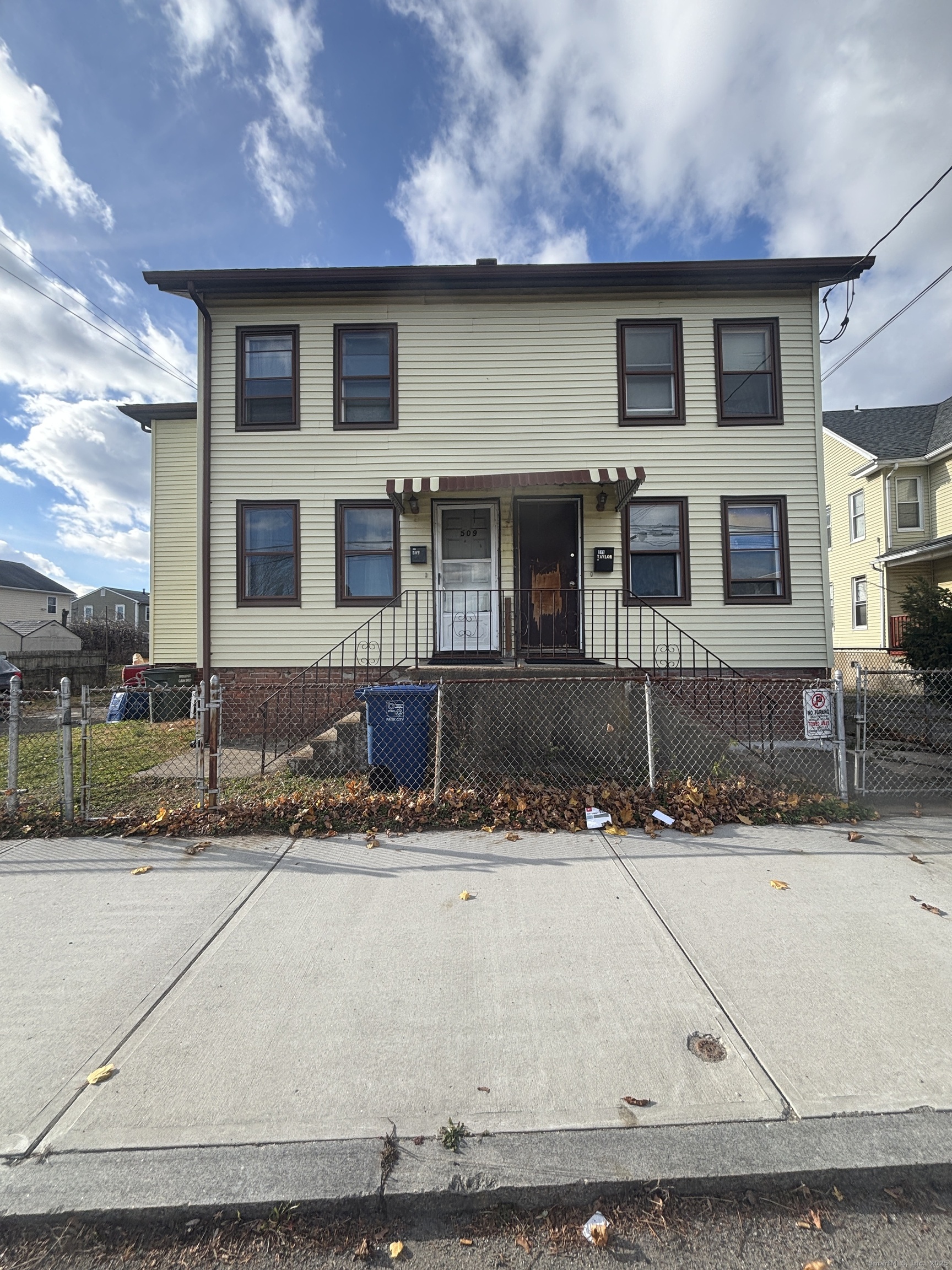 509 Pembroke Street Bridgeport, CT 06608 - Photo 16 of 25 a front view of a house with windows