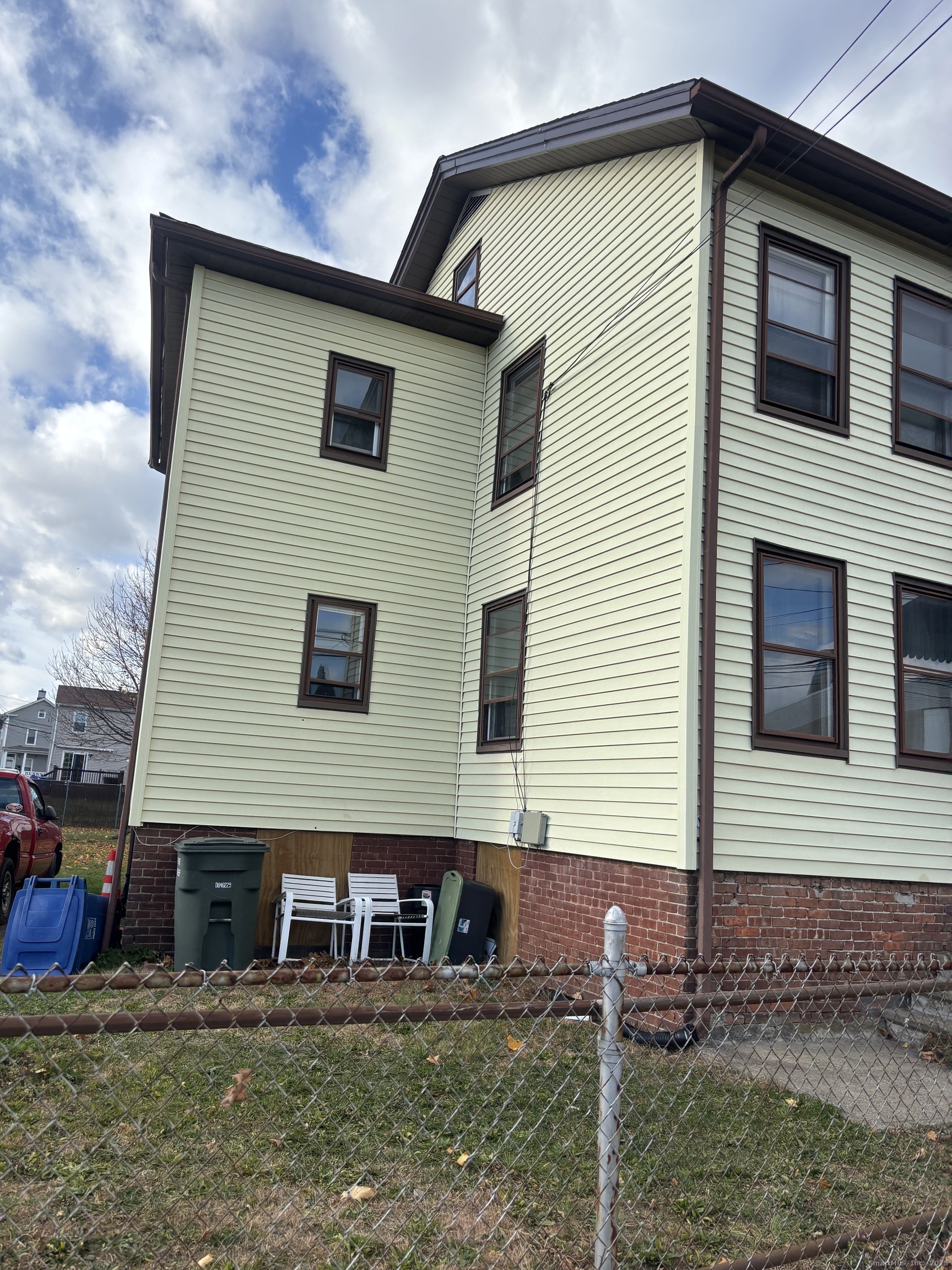509 Pembroke Street Bridgeport, CT 06608 - Photo 19 of 25 a view of front of house with a yard