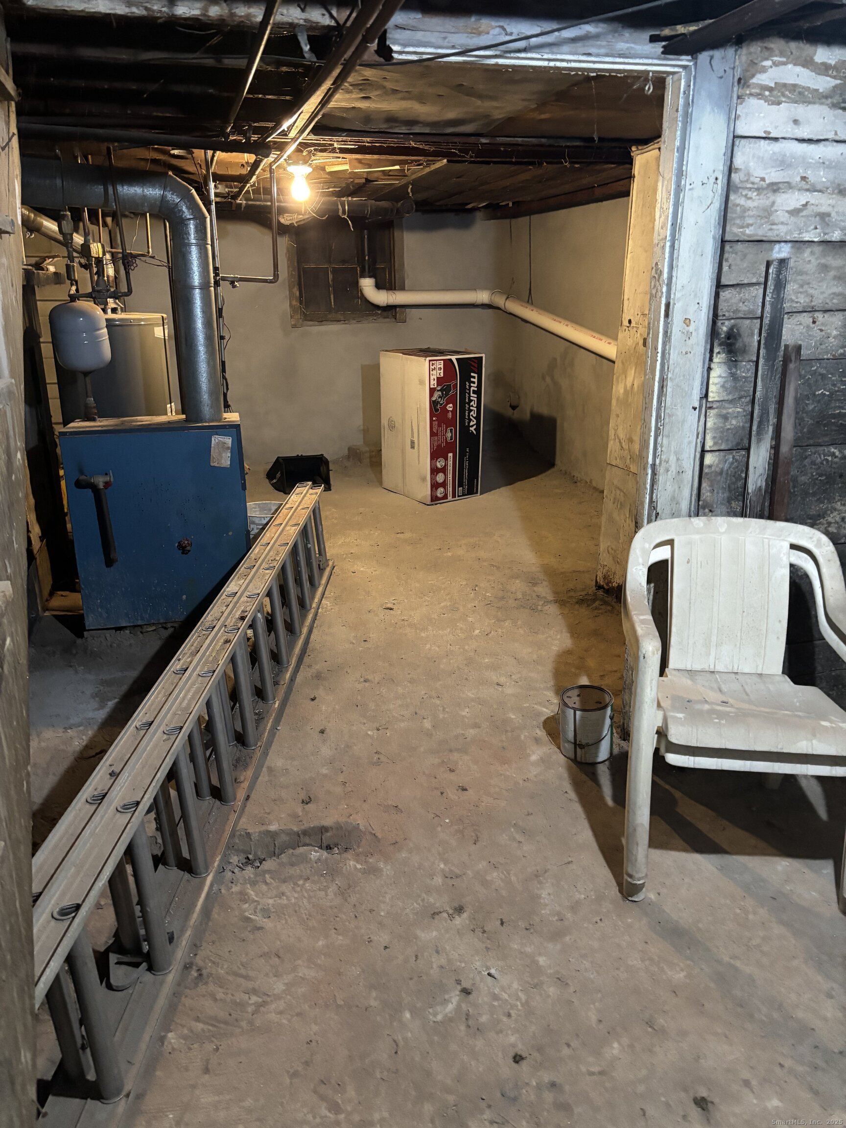 509 Pembroke Street Bridgeport, CT 06608 - Photo 7 of 25 a view of an empty room with wooden stairs