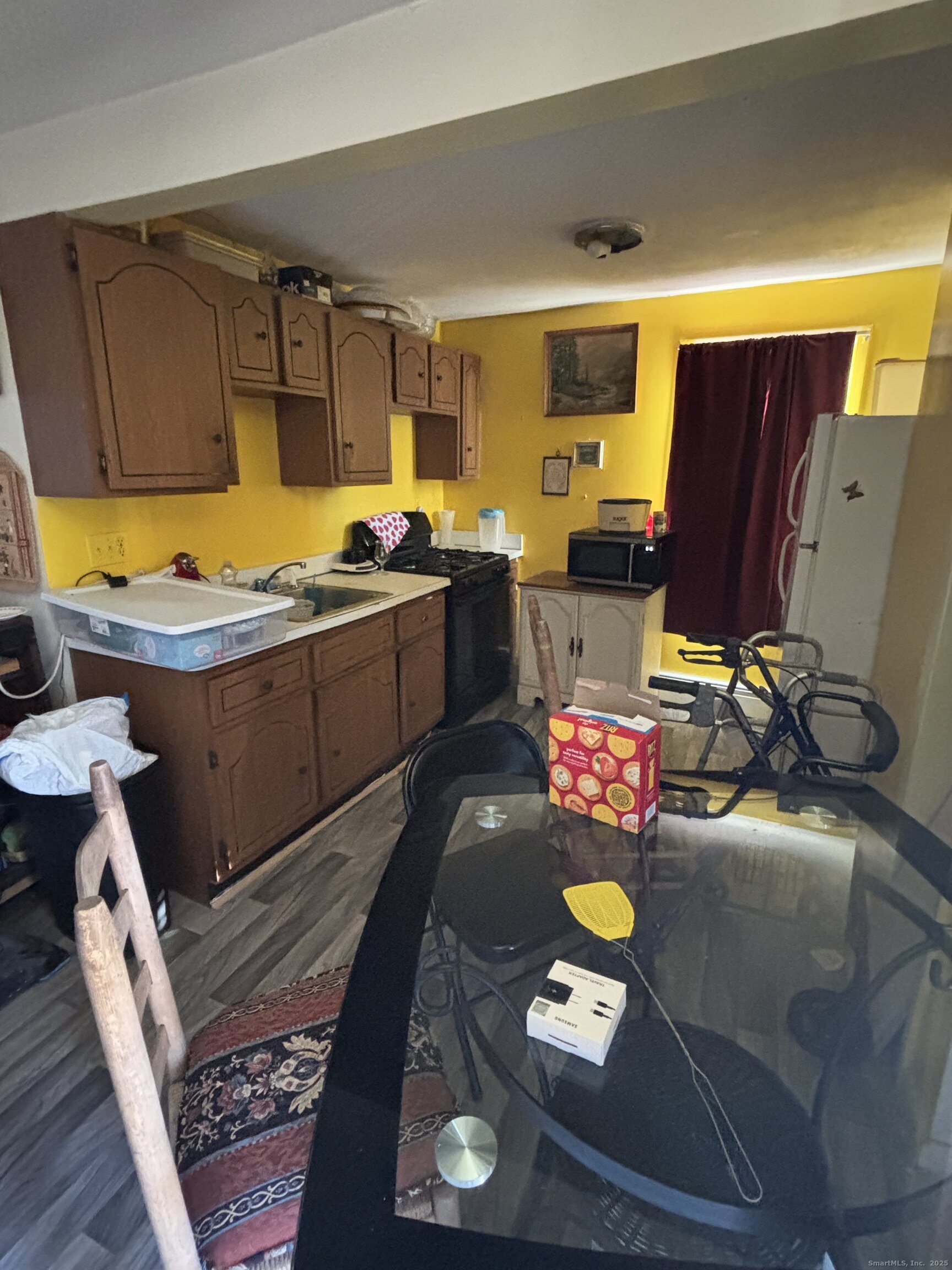 509 Pembroke Street Bridgeport, CT 06608 - Photo 10 of 25 a living room with furniture and a flat screen tv