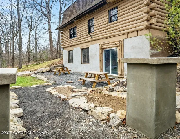 a view of a house with backyard of snow
