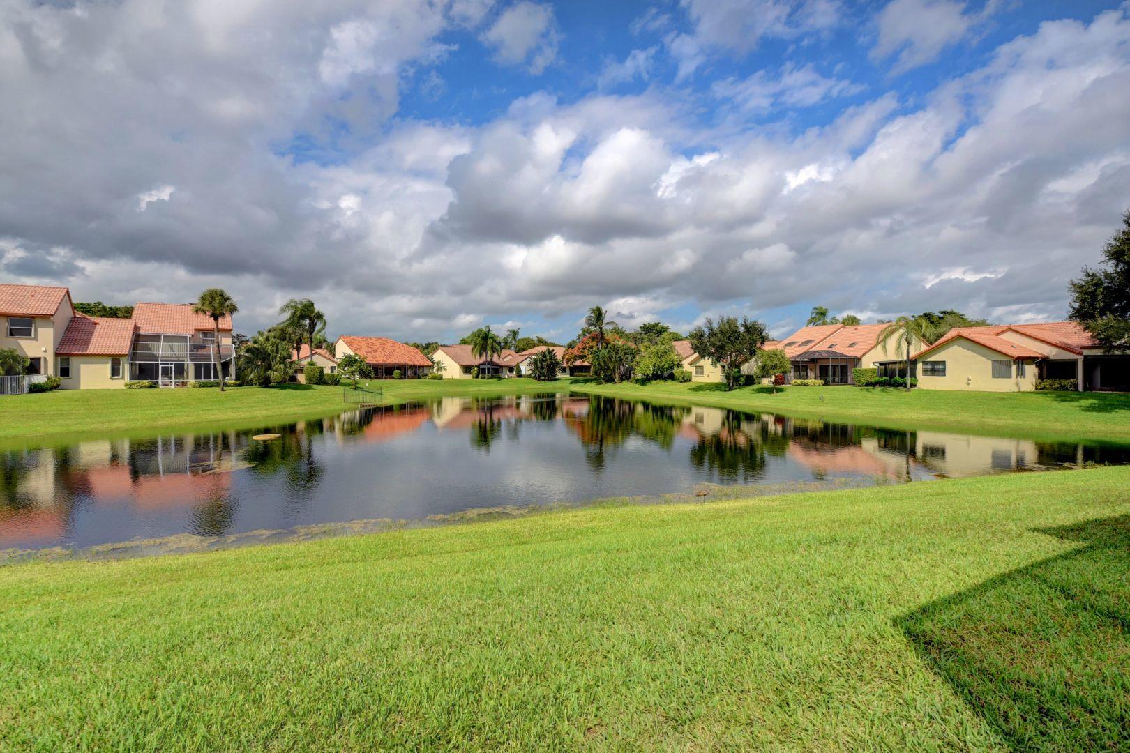 23349 Water Circle Boca Raton, FL 33486 - Photo 3 of 44 Backyard with wide view of lake