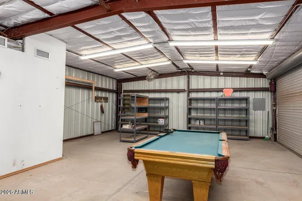 a view of an empty room with a fireplace