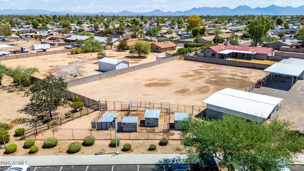 a view of a patio with a table under an umbrella