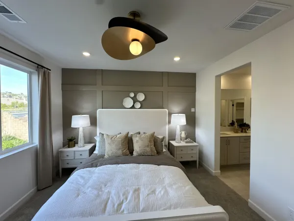 a bed room with a bed and a window