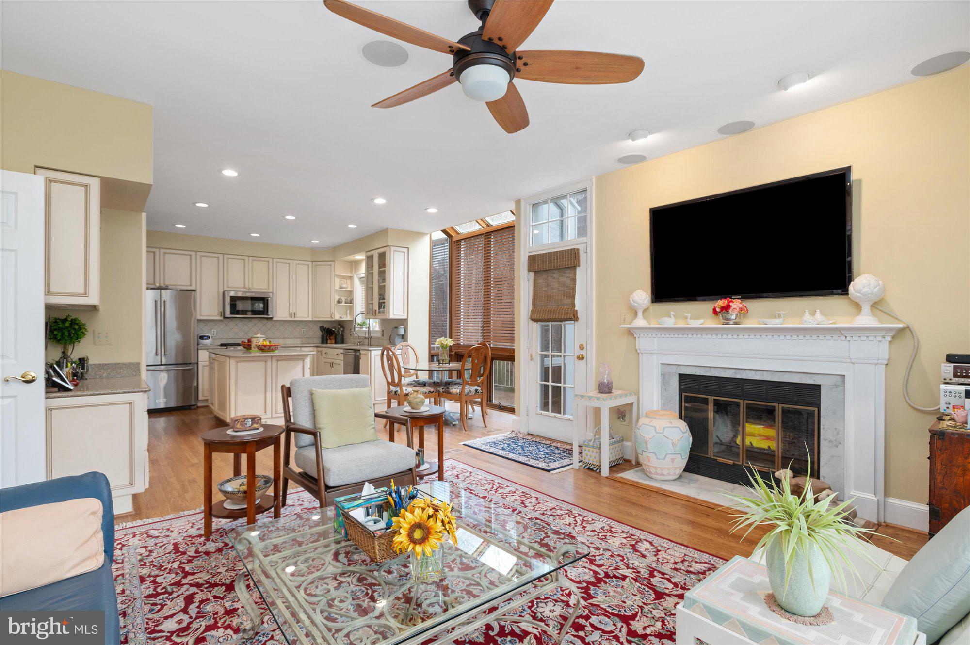 8001 Quarry Ridge Way Bethesda, MD 20817 - Photo 17 of 55 Open Kitchen to Family Room with Wood/Fireplace