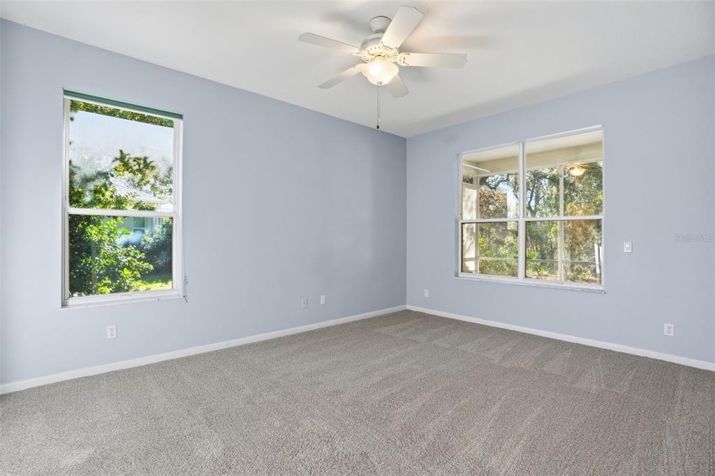 16 Nephthytis Court Homosassa, FL 34446 - Photo 22 of 45 an empty room with a window and a fan
