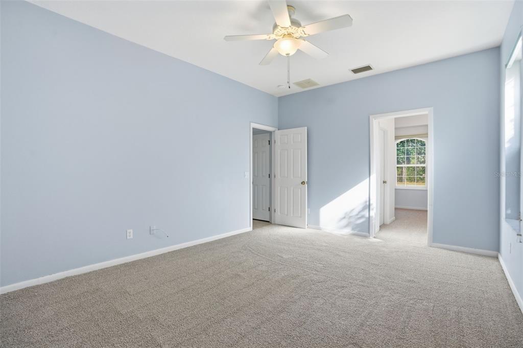 16 Nephthytis Court Homosassa, FL 34446 - Photo 23 of 45 an empty room with a ceiling fan and a window
