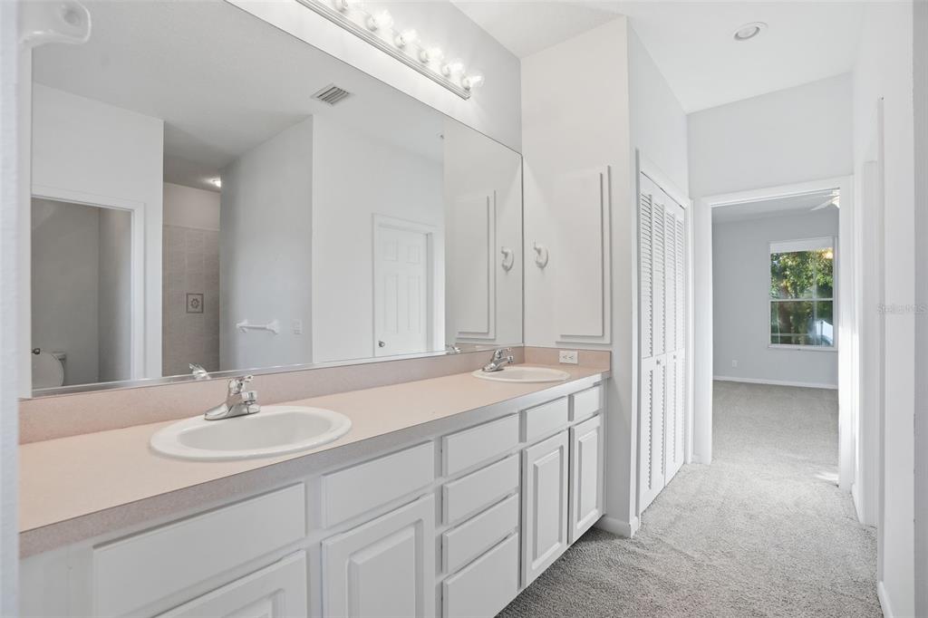 16 Nephthytis Court Homosassa, FL 34446 - Photo 25 of 45 a en suite bathroom with a sink and a mirror