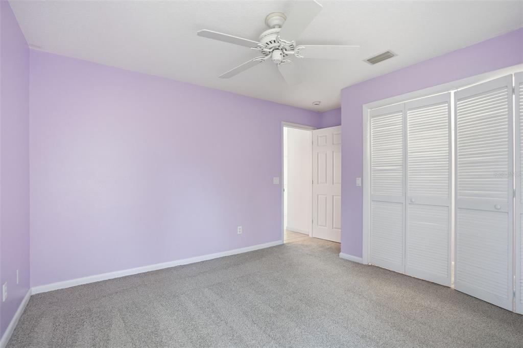 16 Nephthytis Court Homosassa, FL 34446 - Photo 28 of 45 an empty room with a ceiling fan and a window