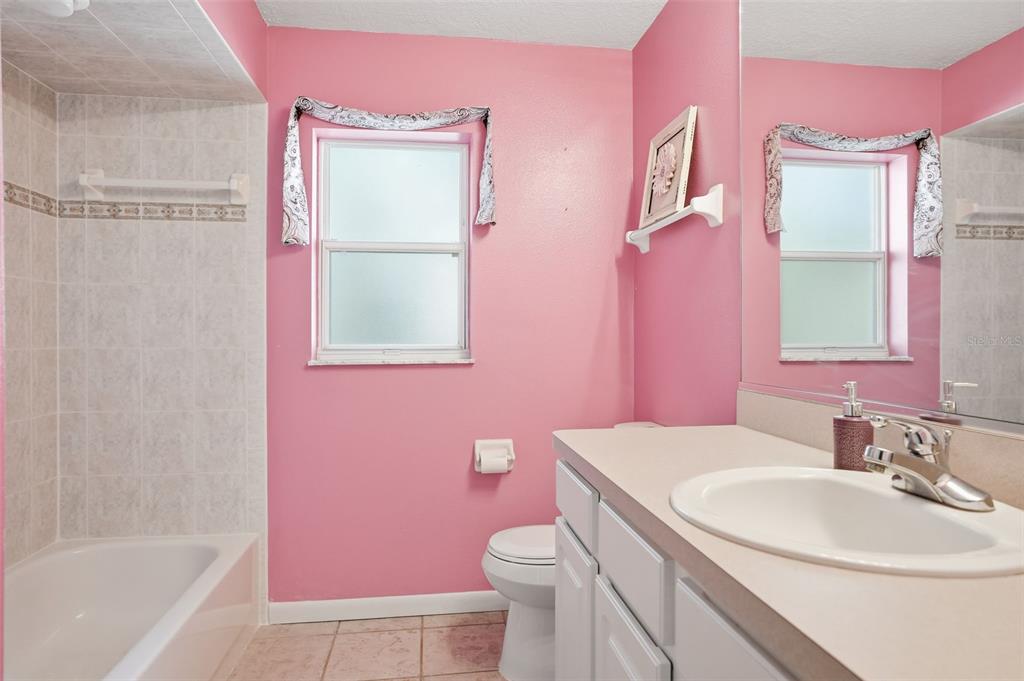 16 Nephthytis Court Homosassa, FL 34446 - Photo 29 of 45 a bathroom with a sink a vanity tub and toilet