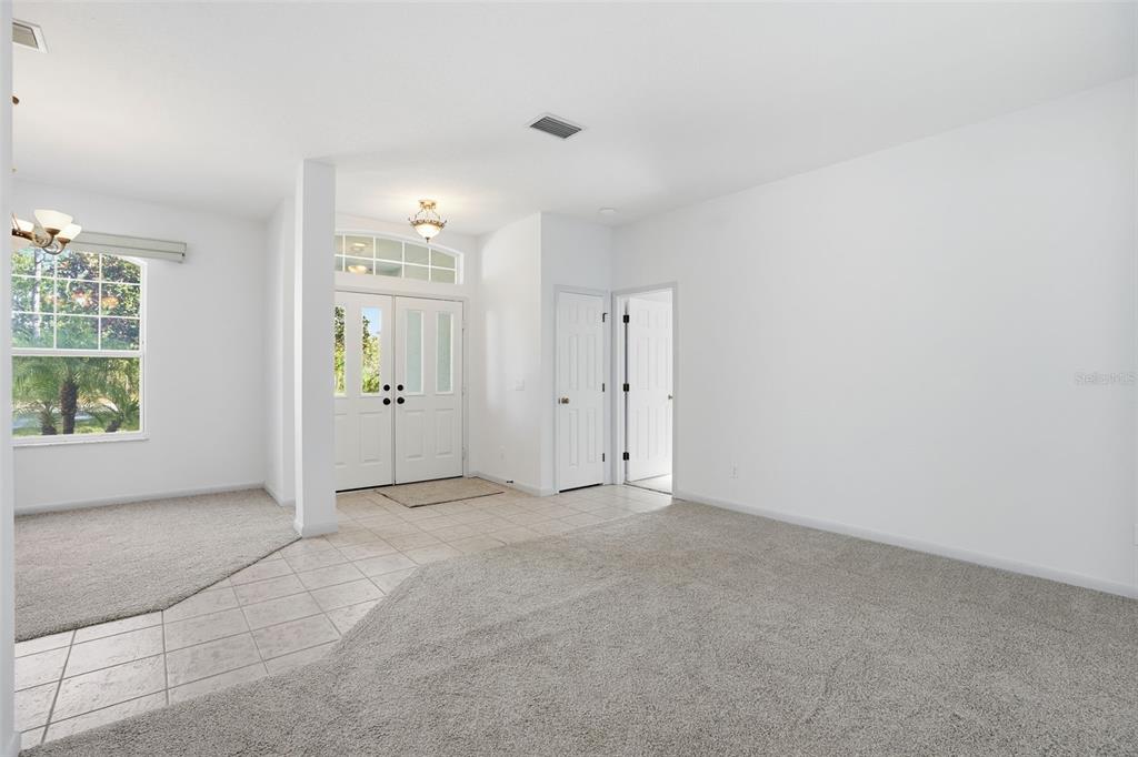 16 Nephthytis Court Homosassa, FL 34446 - Photo 3 of 45 an empty room with windows and closet