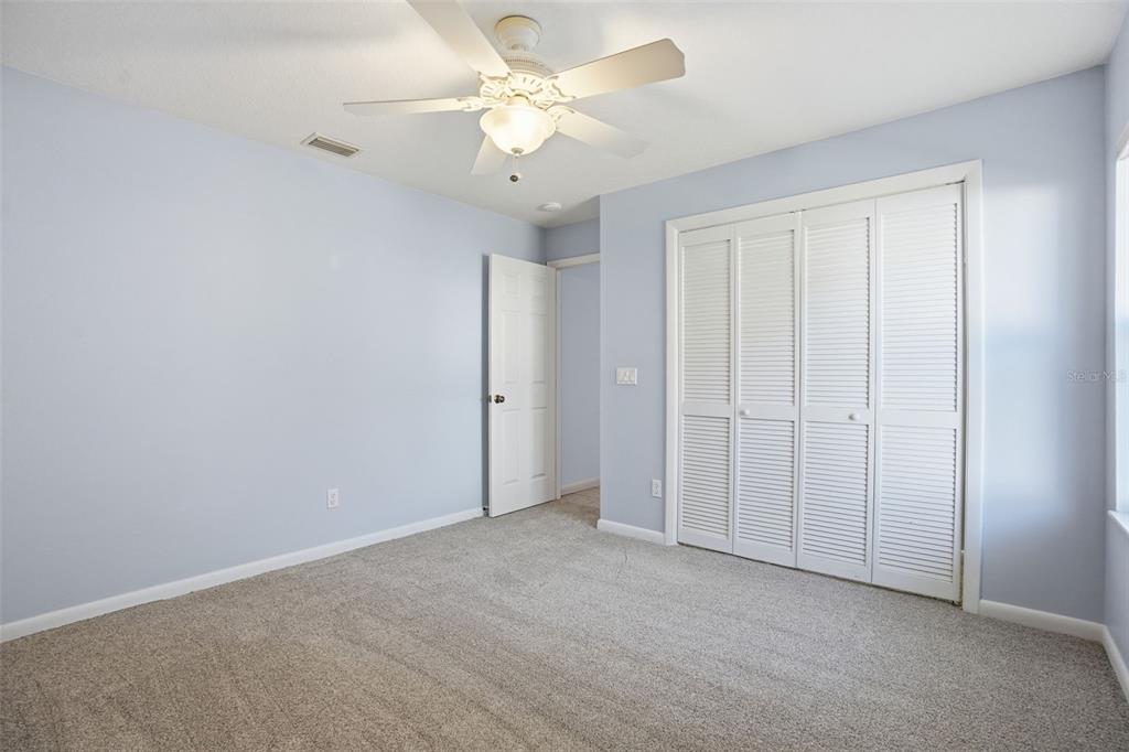 16 Nephthytis Court Homosassa, FL 34446 - Photo 31 of 45 an empty room with chandelier fan