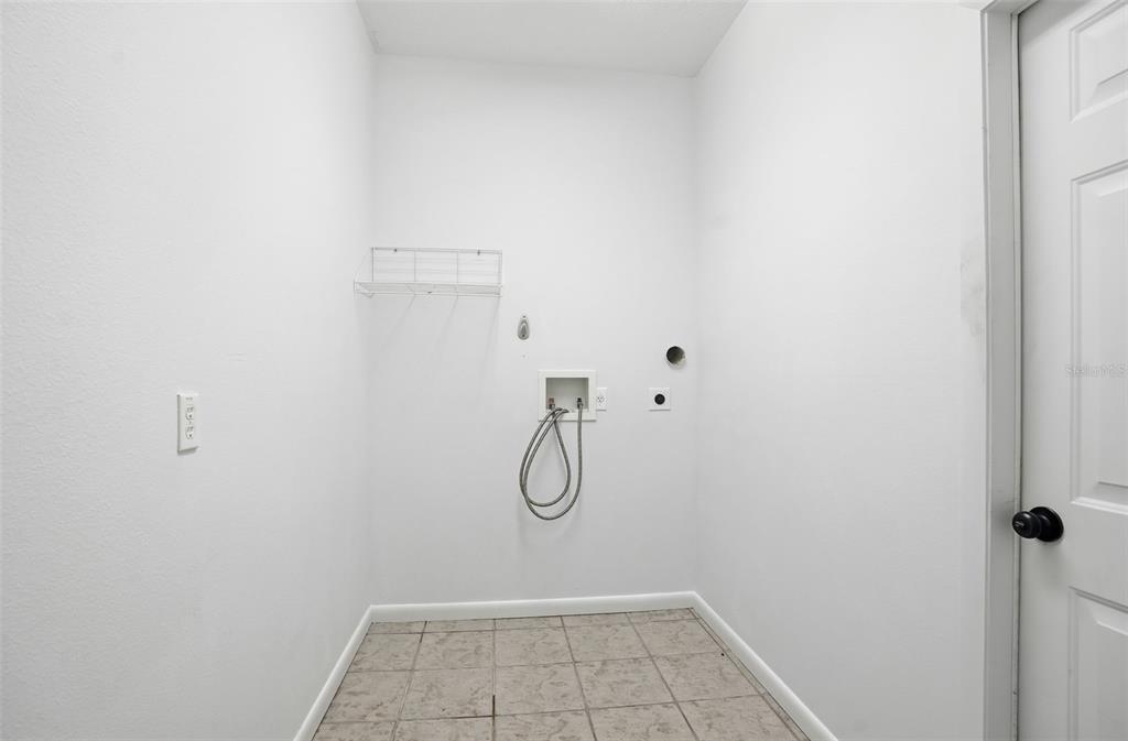 16 Nephthytis Court Homosassa, FL 34446 - Photo 32 of 45 a bathroom with a glass shower door