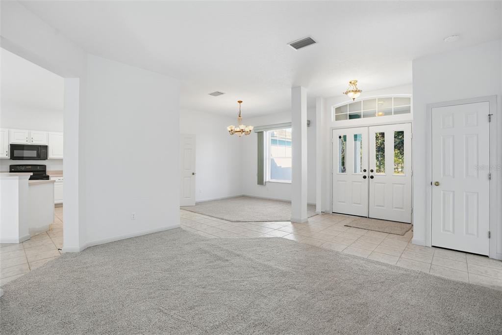 16 Nephthytis Court Homosassa, FL 34446 - Photo 6 of 45 an empty room with kitchen and entrance