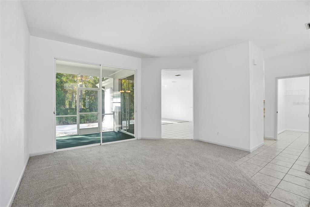 16 Nephthytis Court Homosassa, FL 34446 - Photo 8 of 45 a view of an empty room with glass door