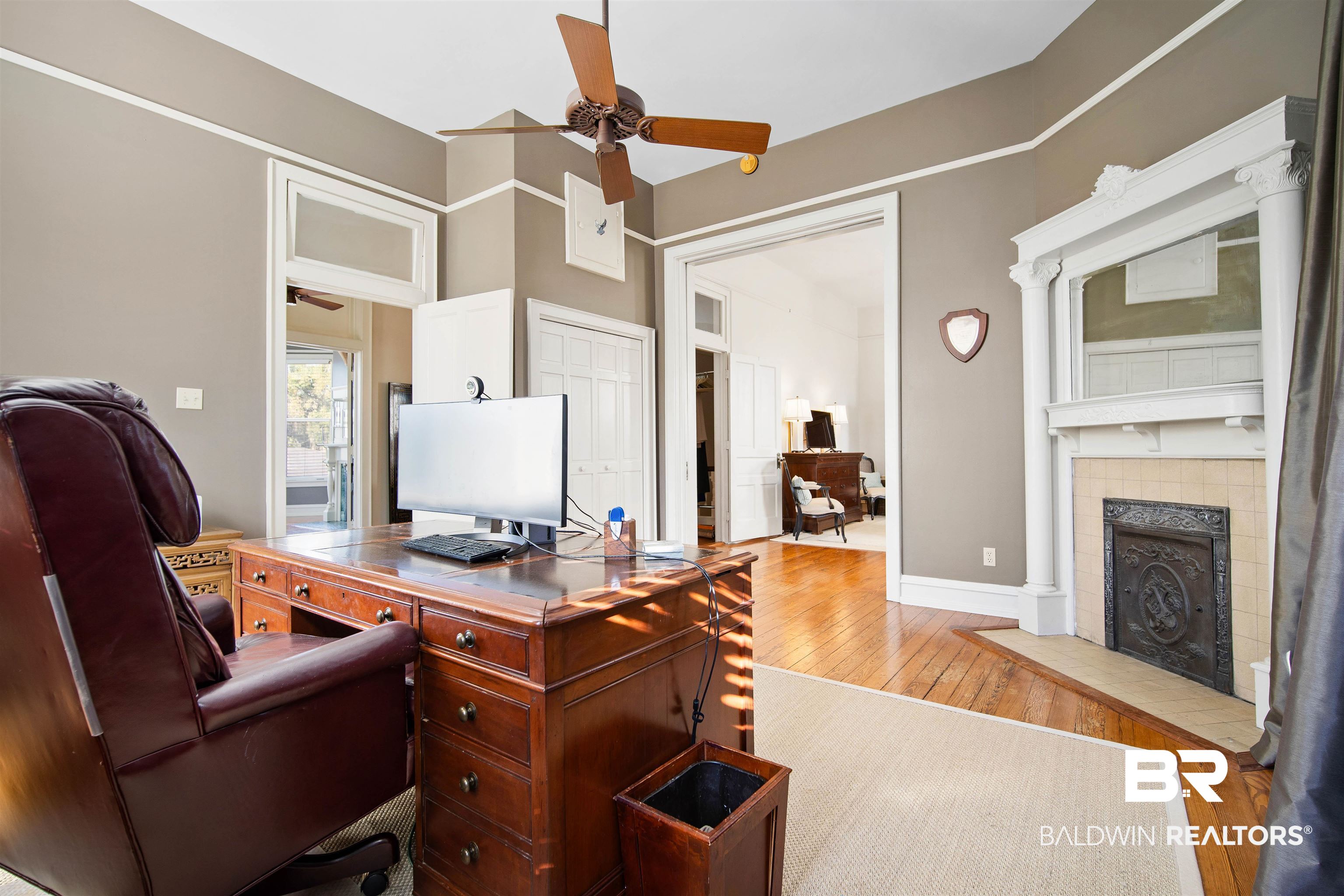 1314 Dauphin Street Mobile, AL 36604 - Photo 34 of 61 office with a fireplace, light hardwood floors, and ceiling fan
