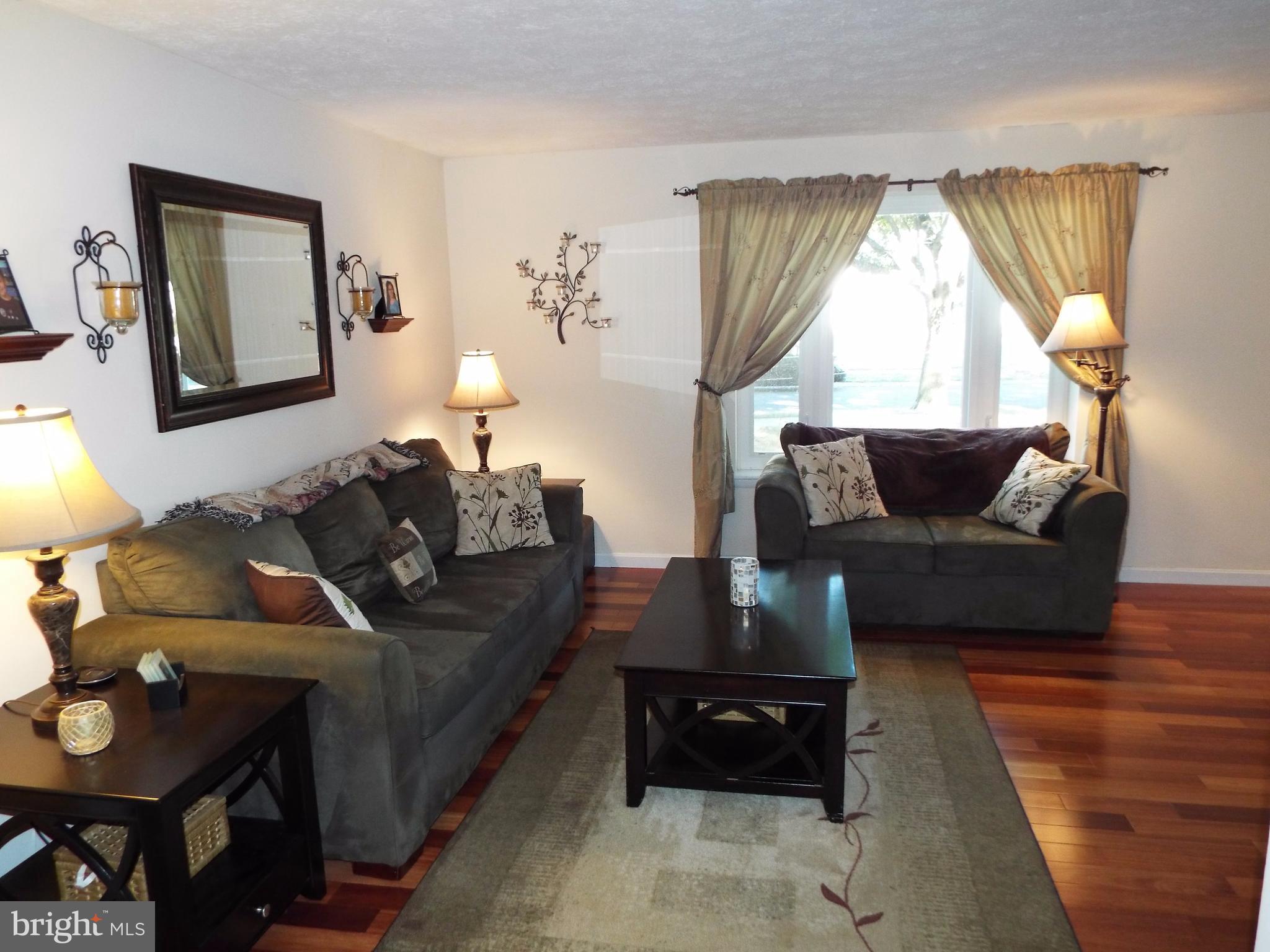 1505 Gollum Road Hanover, MD 21076 - Photo 7 of 30 Living Room with Rich Wide Plank Hardwood Floors