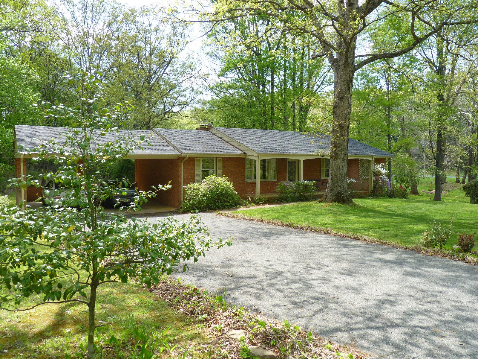 471 Pin Oak Drive Blue Ridge, VA 24064 - Photo 14 of 18 a front view of a house with a yard