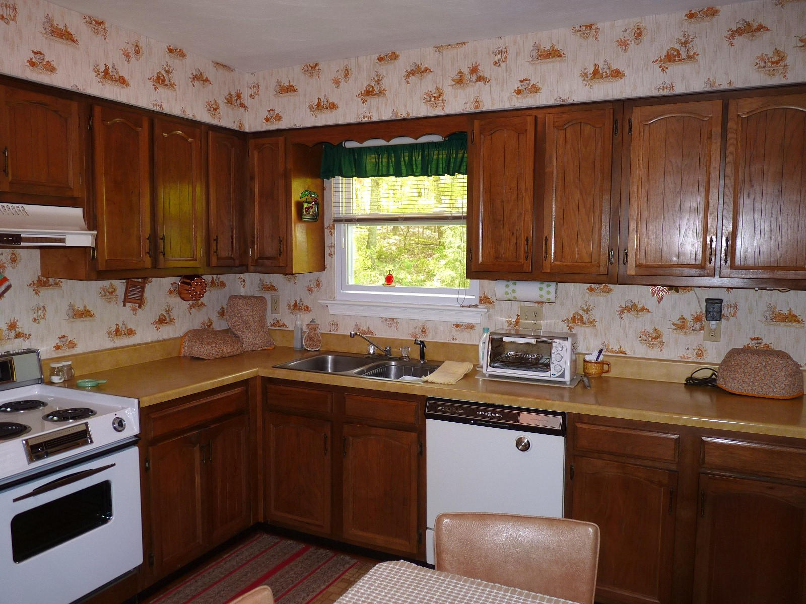 471 Pin Oak Drive Blue Ridge, VA 24064 - Photo 10 of 18 a kitchen with stainless steel appliances a sink dishwasher stove and cabinets