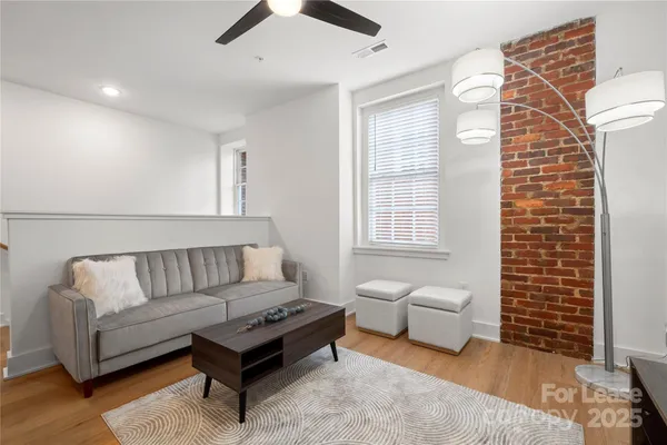 a living room with furniture and a rug