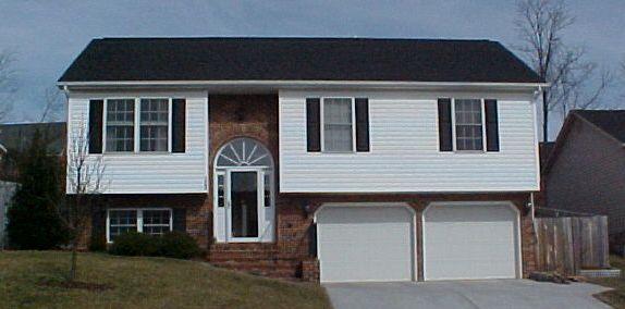 1762 Meadows Road Vinton, VA 24179 - Photo 1 of 12 a front view of a house with a garden