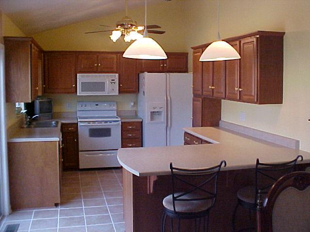 1762 Meadows Road Vinton, VA 24179 - Photo 4 of 12 a kitchen with cabinets and chairs