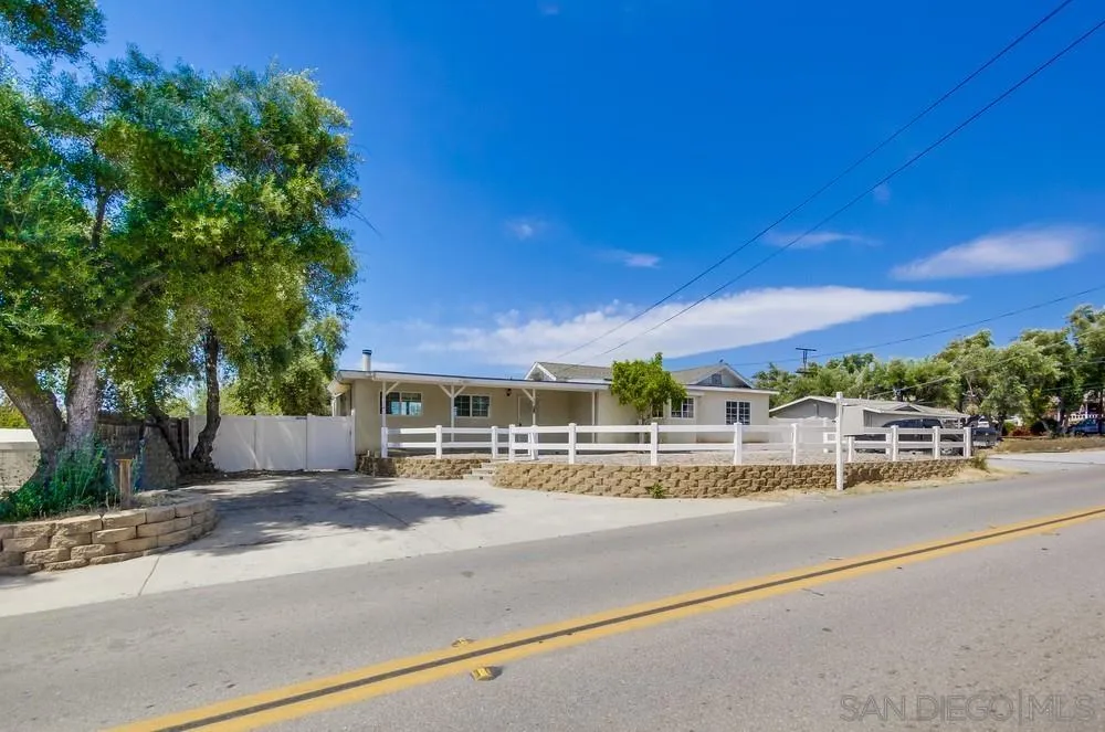 a view of a street with a building in the background