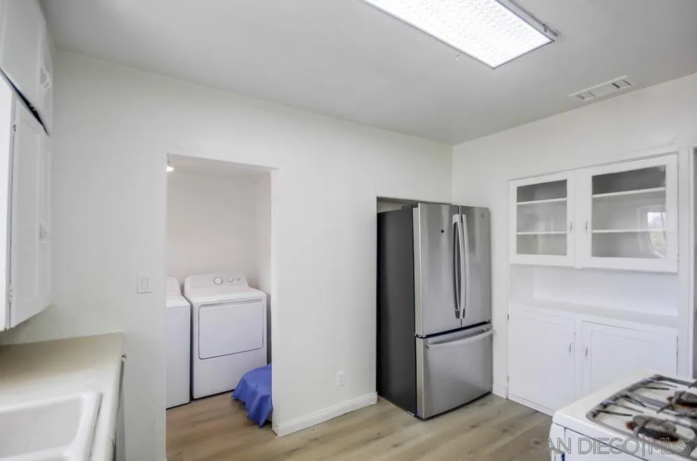 12224 Lemon Crest Drive Lakeside, CA 92040 - Photo 20 of 61 a kitchen with stainless steel appliances a refrigerator and a stove top oven