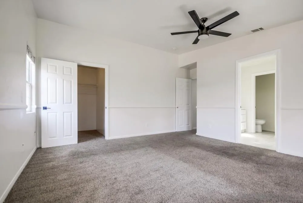 12224 Lemon Crest Drive Lakeside, CA 92040 - Photo 24 of 61 a view of a big room with wooden floor and a ceiling fan
