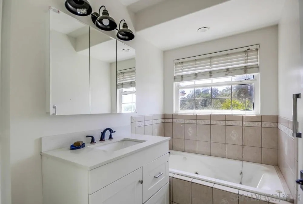 12224 Lemon Crest Drive Lakeside, CA 92040 - Photo 26 of 61 a bathroom with a sink and a bathtub