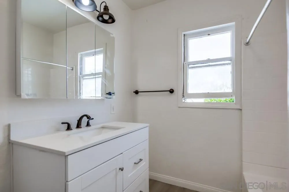 12224 Lemon Crest Drive Lakeside, CA 92040 - Photo 42 of 61 a bathroom with a sink and a window