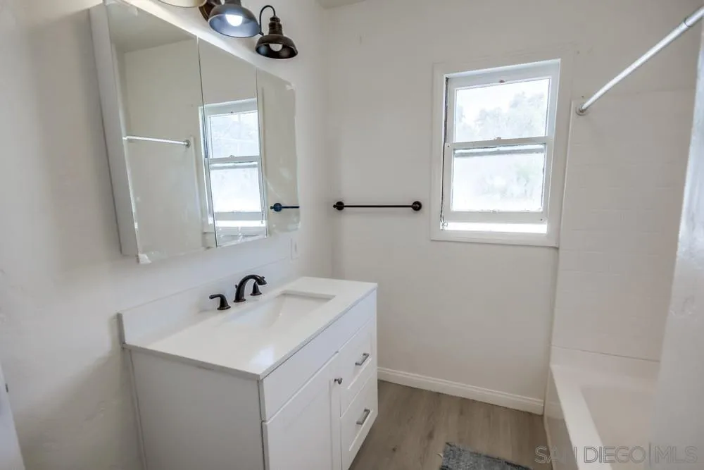 12224 Lemon Crest Drive Lakeside, CA 92040 - Photo 43 of 61 a bathroom with a sink a window and mirror