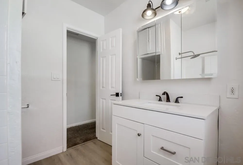 12224 Lemon Crest Drive Lakeside, CA 92040 - Photo 45 of 61 a bathroom with a sink and a mirror