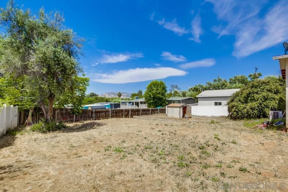 12224 Lemon Crest Drive Lakeside, CA 92040 - Photo 56 of 61 a white house with a large tree in front of it
