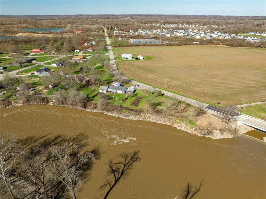 7315 Franklin-Trenton Road Franklin, OH 45005 - Photo 14 of 15 This elevated view captures a serene river winding through a rural landscape, with fields and homes dotting the horizon.