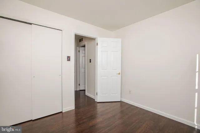 an empty room with wooden floor