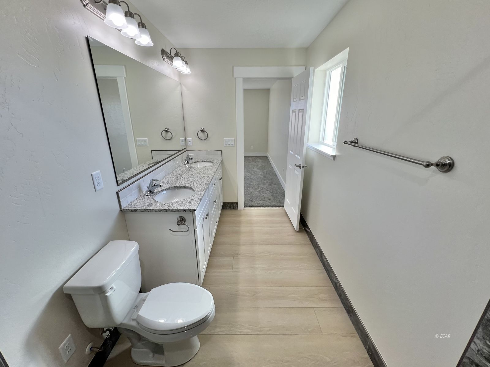 1096 Sun Vly Road Spring Creek, NV 89815 - Photo 21 of 31 a bathroom with a toilet sink and mirror