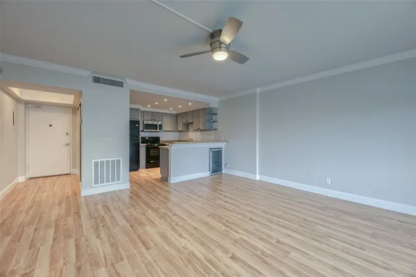 a kitchen with stainless steel appliances granite countertop a sink stove and wooden floor