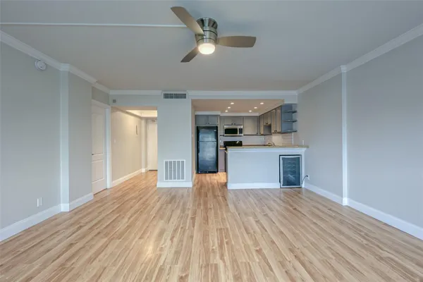 a kitchen with granite countertop stainless steel appliances and wooden cabinets