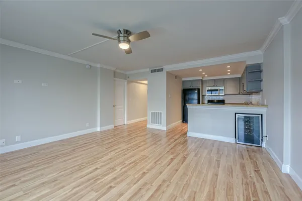 a kitchen with stainless steel appliances granite countertop a refrigerator sink and stove