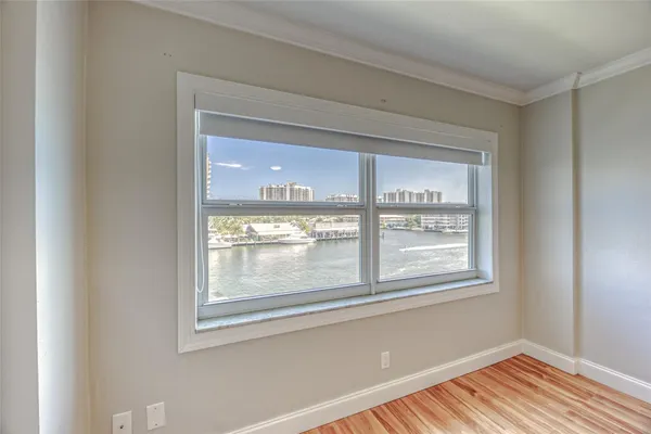 a view of swimming pool with outdoor seating and lake view