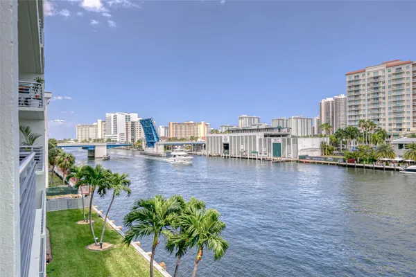 a swimming pool view with a outdoor seating