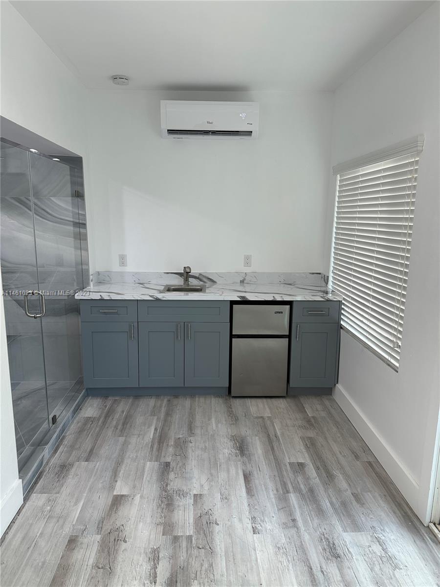 2900 Southwest 4th Street, Unit 2900 Miami, FL 33135 - Photo 3 of 4 a view with a sink cabinets and wooden floor
