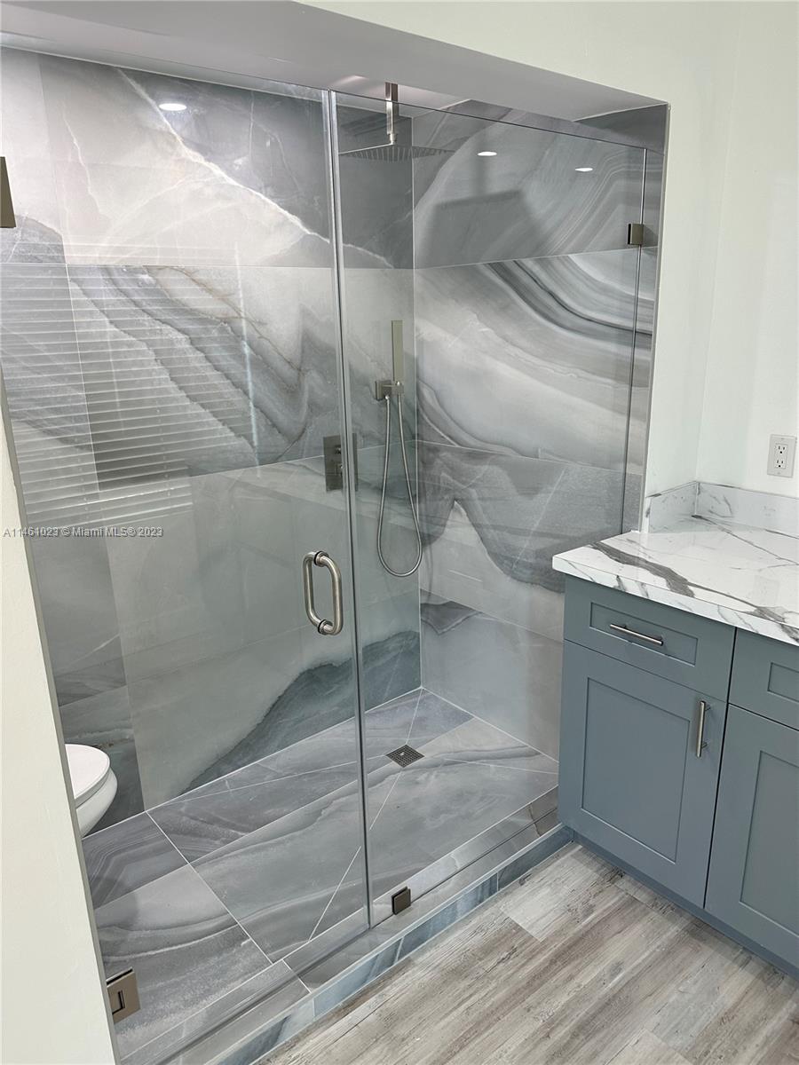 2900 Southwest 4th Street, Unit 2900 Miami, FL 33135 - Photo 4 of 4 a bathroom with a granite countertop shower