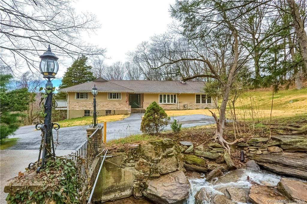 273 Daniels Farm Road Trumbull, CT 06611 - Photo 1 of 1 Beyond the extended driveway across the bridge