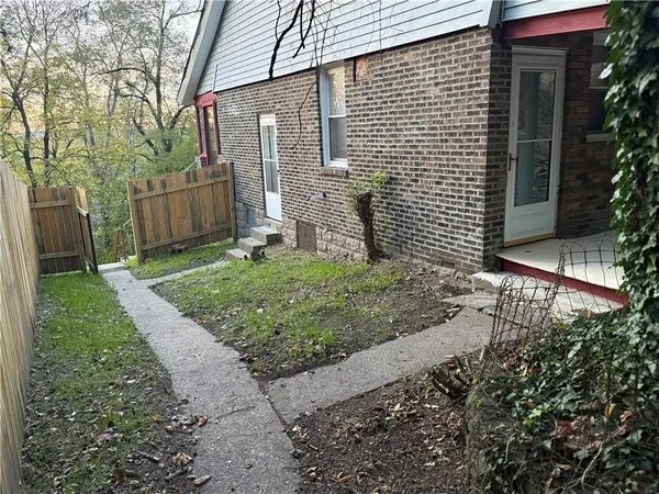 a view of a back yard of the house